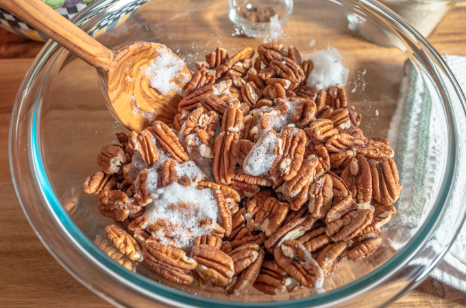 pecans in a bowl with a spoon